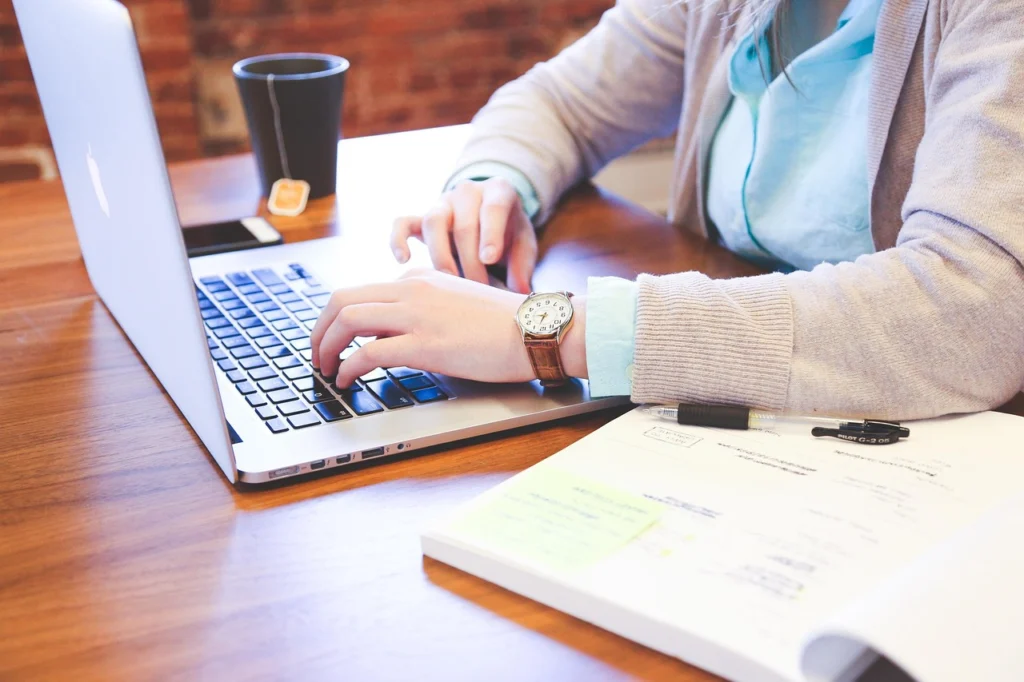 Person using Semrush keyword research tool on a laptop with color-coded keyword difficulty charts